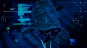 hacker - person in hoodie with blue tech overlays
