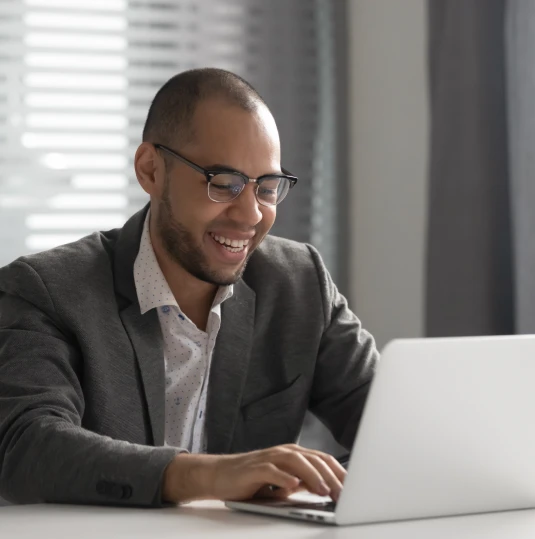 man typing on laptop